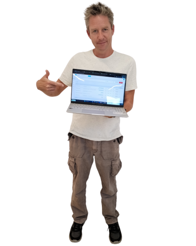 Alistair Williams holding a laptop